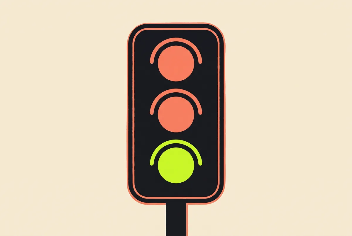 A traffic light with the lower lamp lit, standing for the go signal a reaction test waits on.